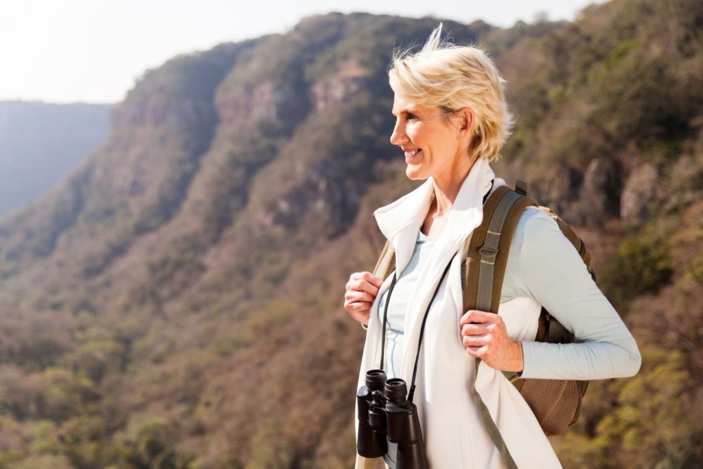 Woman Enjoying The Outdoors and Happy After Selling Her Real Estate Contract